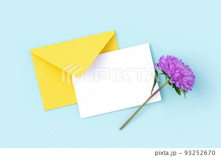 White blank card, yellow envelope and purple flower on blue background. Minimal style. Top view Flat lay Mockup White blank card, yellow envelope and purple flower on blue background. Minimal style. Top view Flat lay Mockup 93252670