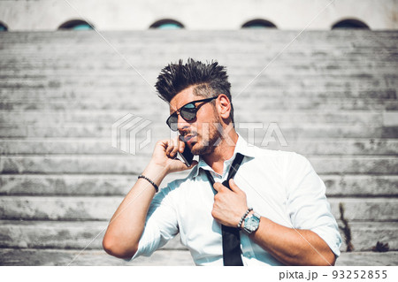 Depressed unsuccessful businessman feels terrible headache, hands shocked by bankruptcy stock downfall sitting on stone stairs. Stressed tired man feels despair lost money online or got problem debt. 93252855