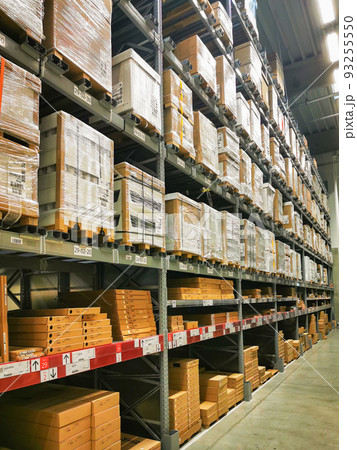 Multi-tiered shelves with goods in a large warehouse 93255550
