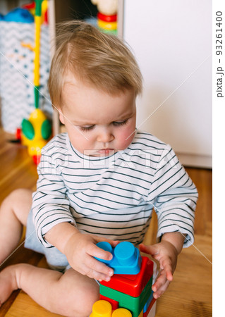 Cute little child is playing at home 93261400