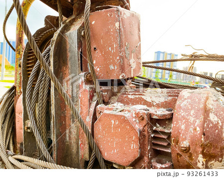 construction tool with wound black fishing line. large, red pump. the metal is rusty. retro equipment for construction and repair construction tool with wound black fishing line. large, red pump. the metal is rusty. retro equipment for construction and repair 93261433