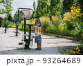 Adorable little 1-2 year old toddler boy having fun on playground in Krakow, Poland 93264689