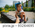 Adorable little 1-2 year old toddler boy having fun on playground in Krakow, Poland 93264695