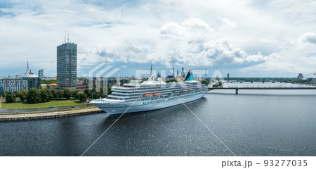 Beautiful cruise ship docked in Riga, Latvia near the old town and the bridge. Beautiful cruise ship docked in Riga, Latvia near the old town and the bridge. 93277035