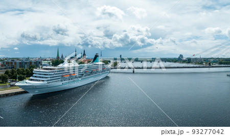 Beautiful cruise ship docked in Riga, Latvia near the old town and the bridge. Beautiful cruise ship docked in Riga, Latvia near the old town and the bridge. 93277042