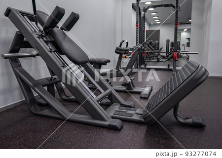 Modern light gym. Sports equipment in gym. Modern light gym. Sports equipment in gym. 93277074