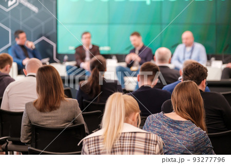 Group of people participating in business seminar in conference hall 93277796
