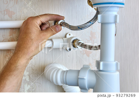 Braided plumbing hoses are used to install faucet in bathroom and connect to home water supply system. 93279269