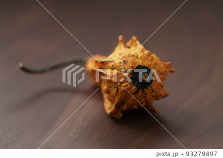Decorative pear pumpkin on wood table Decorative pear pumpkin on wood table 93279897