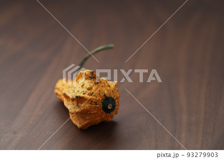 Decorative pear pumpkin on wood table Decorative pear pumpkin on wood table 93279903