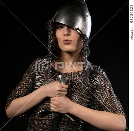 Sexy woman in viking helmet and hauberg with sword 93280828