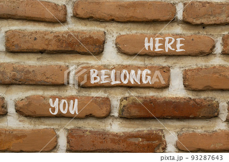 You belong here and support symbol. Concept words You belong here on brick wall. Beautiful brick wall background. Psychological business and you belong here concept. Copy space. 93287643