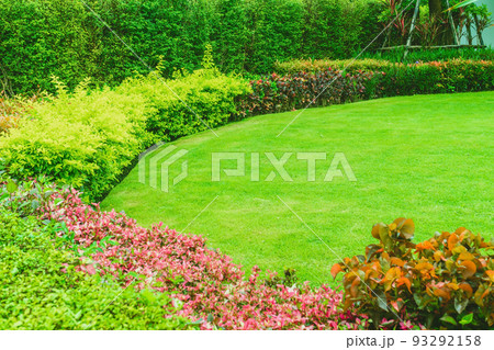 Landscaped Formal, Front yard with garden design, Green lawn, Garden design, Landscaping in the garden, Gardening for the background. Landscaped Formal, Front yard with garden design, Green lawn, Garden design, Landscaping in the garden, Gardening for the background. 93292158