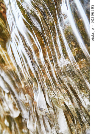 Waves of smooth ice on rock wall in winter 93296295