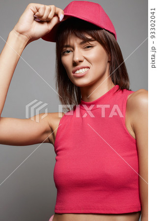 beautiful Girl in Pink Hat. Smiling young woman beautiful Girl in Pink Hat. Smiling young woman 93302041