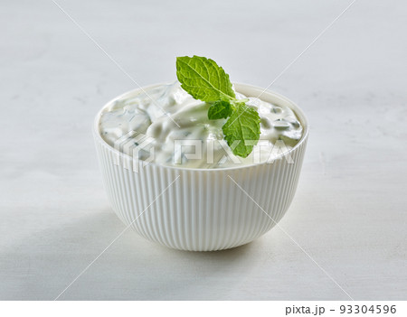 bowl of sour cream or greek yogurt 93304596