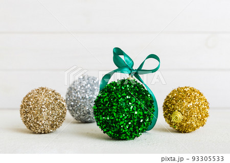 Christmas ball on colored background. decoration bauble with ribbon bow with copy space 93305533