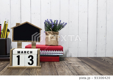 March 13 calendar date text on white wooden block with on wooden desk. March 13 calendar date text on white wooden block with on wooden desk. 93306420