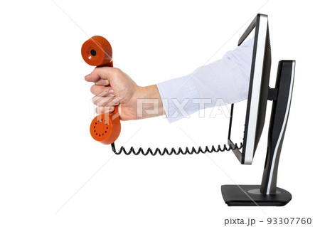 Hand with phone receiver coming out of a computer monitor Hand with phone receiver coming out of a computer monitor 93307760