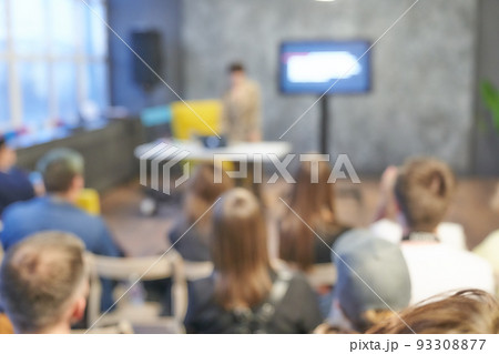Blurred background of the business conference, one man on the stage, presentation of the project, public talk. Dark background. Copy space. Audience on the event, group of people on the training. Blurred background of the business conference, one man on the stage, presentation of the project, public talk. Dark background. Copy space. Audience on the event, group of people on the training. 93308877