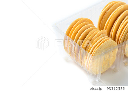 Round Crackers biscuits in plastic box isolated on white background, Round Crackers biscuits in plastic box isolated on white background, 93312526