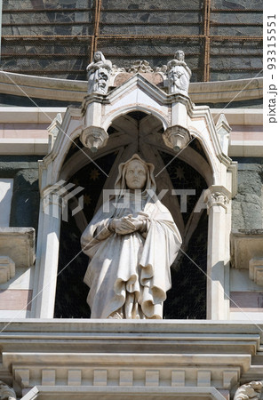 Statue on the portal of Basilica of Santa Croce - famous Franciscan church in Florence, Italy 93315551