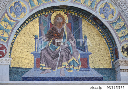 Saint John the Baptist colourful mosaic by Giuseppe Modena da Lucca, lunette above right door of Cathedral in Pisa, Italy. Unesco World Heritage Site. 93315575