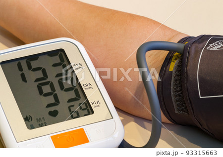 Measuring blood pressure close-up. Too high blood pressure. Measuring blood pressure close-up. Too high blood pressure. 93315663