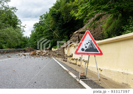 Automobile sign of falling stones. Watch out for rockfall. Rockfall danger. 93317397