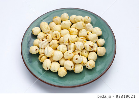 Dried lotus seeds on white background. 93319021