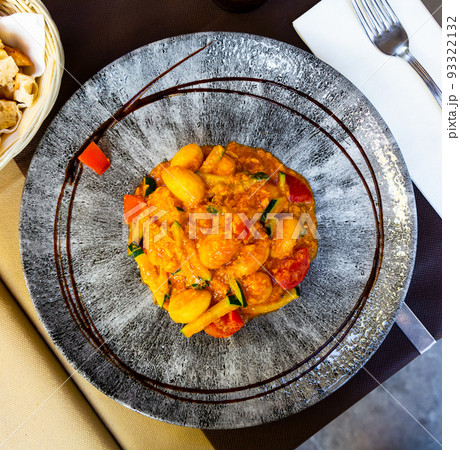 Top view of Italian gnocchi with zucchini and salmon 93322132