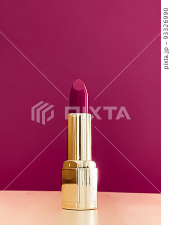 Purple lipstick in golden tube on colour background, luxury make-up and cosmetics for beauty brand product design concept 93326990