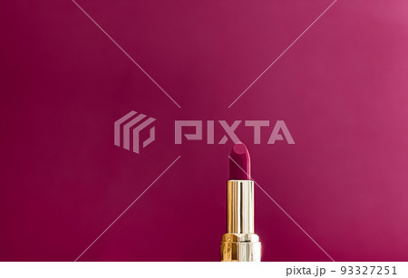 Purple lipstick in golden tube on colour background, luxury make-up and cosmetics for beauty brand product design concept 93327251
