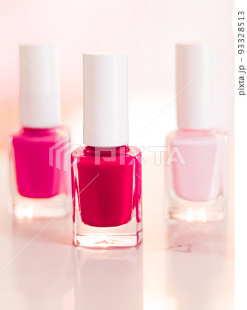 Shades of pink and red nail polish set on glamour background, nailpolish bottles for manicure and pedicure, luxury beauty cosmetics and make-up brand ad Shades of pink and red nail polish set on glamour background, nailpolish bottles for manicure and pedicure, luxury beauty cosmetics and make-up brand ad 93328513