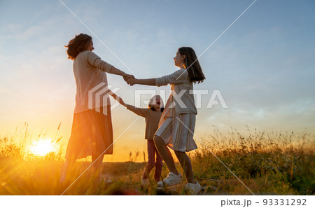 Happy family at sunset Happy family at sunset 93331292