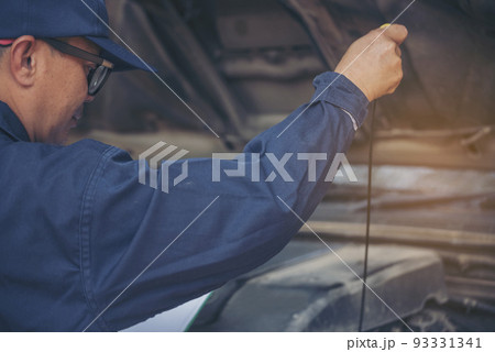 Mechanic car service auto garage in automotive mobile center. Technician workshop repair engine motor vehicles service mechanical engineering business. Automobile mechanic hands car repairs technic Mechanic car service auto garage in automotive mobile center. Technician workshop repair engine motor vehicles service mechanical engineering business. Automobile mechanic hands car repairs technic 93331341
