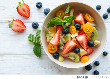 Healthy fresh fruit salad in a bowl Healthy fresh fruit salad in a bowl 93335495