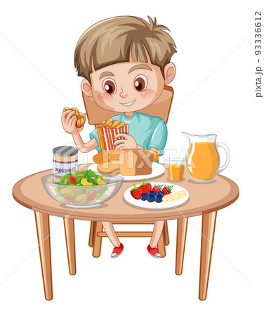 A boy having meal at the table A boy having meal at the table 93336612