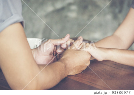yes or no Couple lover holding hands together and asking to propose .. will you marry me ? Yes, I do. 93336977