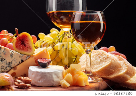 Wine and cheese on the table Wine and cheese on the table 93337230