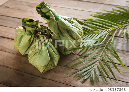 Khmer food takeaway packed in eco-friendly lotus leaves in Siem Reap, Cambodia Khmer food takeaway packed in eco-friendly lotus leaves in Siem Reap, Cambodia 93337868