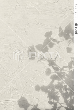 Shadow of flowers on beige concrete wall texture background Shadow of flowers on beige concrete wall texture background 93340375