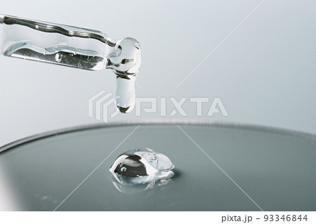 Pipette with sample of gels cosmetic product in petri dish on grey background, hard shadows, selective focus Pipette with sample of gels cosmetic product in petri dish on grey background, hard shadows, selective focus 93346844