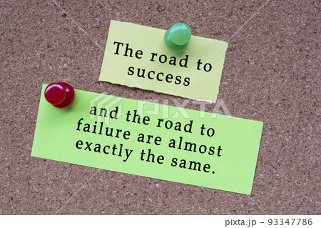 Motivational quote on stick note and pinned to a cork notice board. Motivational quote on stick note and pinned to a cork notice board. 93347786