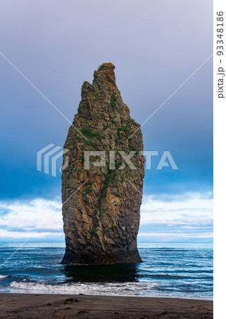 seascape of Kunashir, ocean shore with a huge vertical rock in the water 93348186