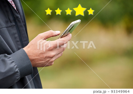 Man rates app in smartphone Man rates app in smartphone 93349964