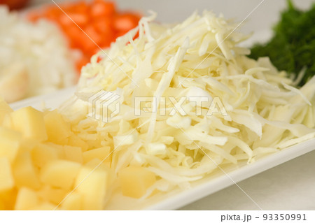 Close-up of chopped cabbage for making traditional Ukrainian borscht. Close-up of chopped cabbage for making traditional Ukrainian borscht. 93350991