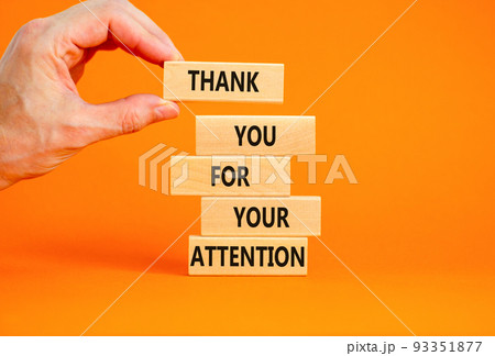 Thank you for attention symbol. Concept words Thank you for your attention on wooden blocks on beautiful orange table orange background. Businessman hand. Business and thank you for attention concept. 93351877