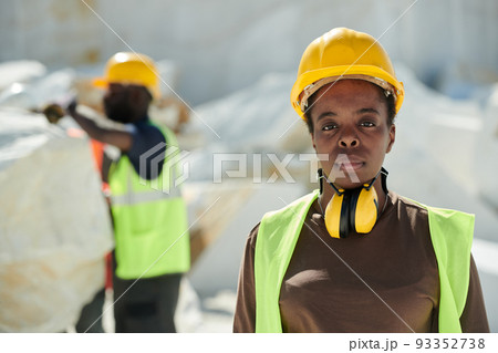 Young serious African American female worker of marble quarry looking at camera 93352738
