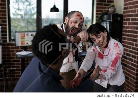 Creepy angry zombies chasing after businessman, frightened person running from brain eating bloodthirsty monsters. Scared man being afraid of undead aggressive corpses, walking dead. Creepy angry zombies chasing after businessman, frightened person running from brain eating bloodthirsty monsters. Scared man being afraid of undead aggressive corpses, walking dead. 93353574